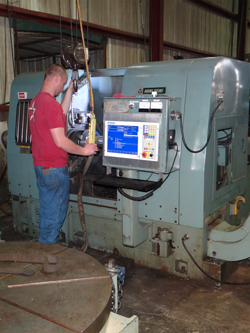 Mori Seiki operator removing part from machine